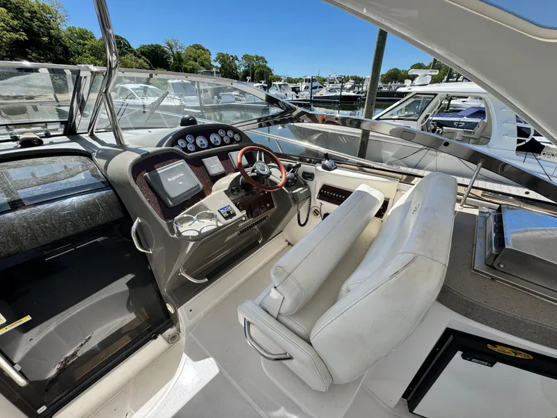 Slide: The Image of Luxurious seating on 2009 Regal Commodore 4060 yacht, overlooking serene ocean view. - 13