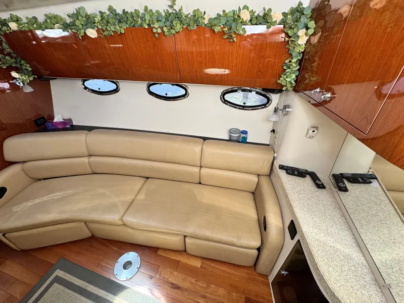 Slide: The Image of Luxurious interior of 2009 Regal Commodore 4060 yacht with leather seating and wood accents. - 19