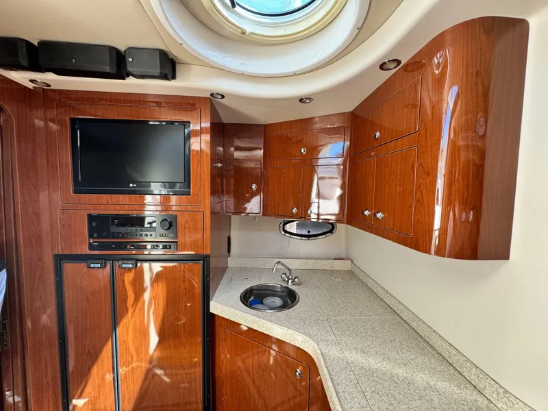Slide: The Image of Luxurious cabin interior of 2009 Regal Commodore 4060 yacht with cozy bedding. - 22