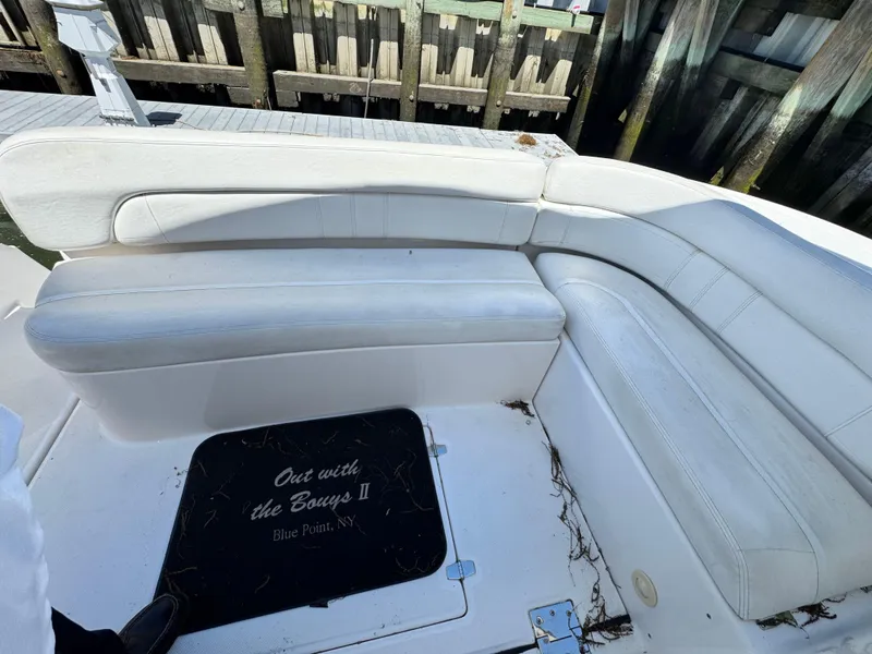 Slide: The Image of 2009 Regal Commodore 4060 yacht interior with white seating and ocean view. - 7