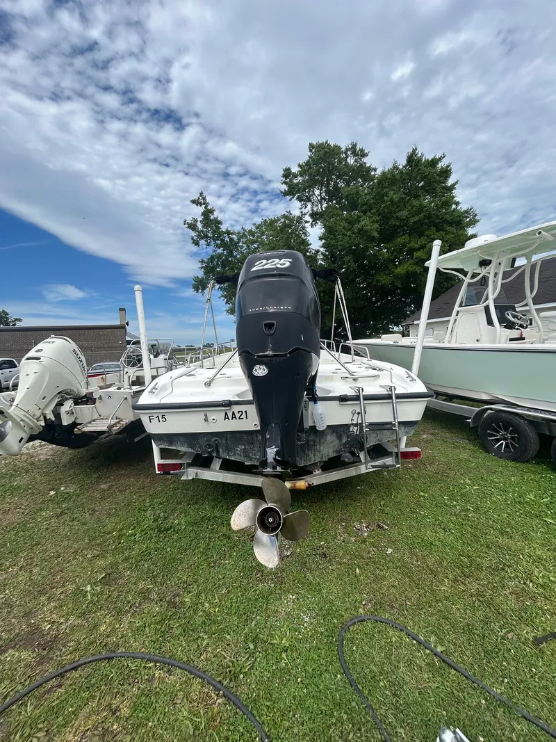 Slide: The Image of 2005 Boston Whaler 220 Dauntless boat with Mercury engine on trailer, sunny day. - 3