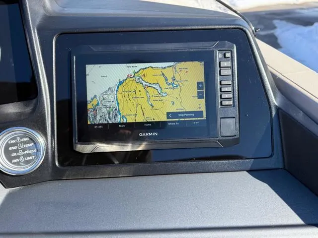 Slide: The Image of Garmin navigation system on 2025 Tahoe Cascade 2385 Versatile Rear Lounger boat dashboard. - 15