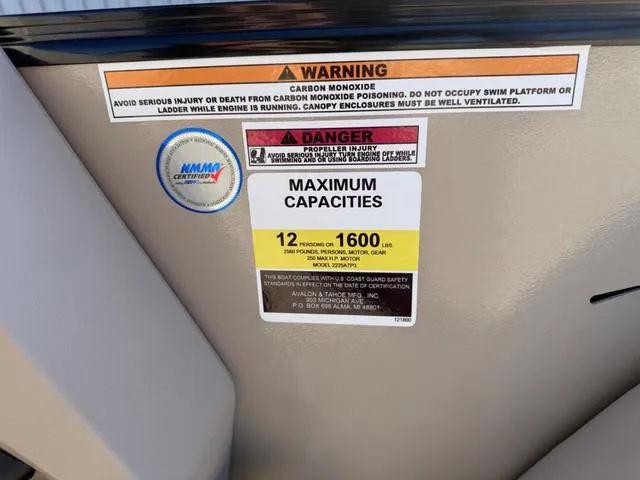 Slide: The Image of Warning labels on 2025 Tahoe Cascade 2385 Versatile Rear Lounger, showing maximum capacities and safety instructions. - 22