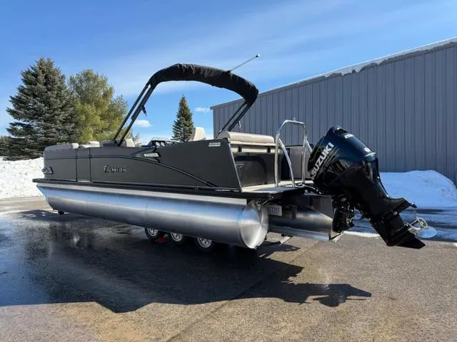 Slide: The Image of 2025 Tahoe Cascade 2385 Versatile Rear Lounger pontoon boat with Suzuki outboard motor. - 5