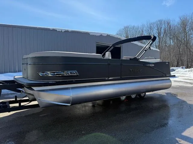 Slide: The Image of 2025 Tahoe Cascade 2385 Versatile Rear Lounger pontoon boat parked outdoors. - 7