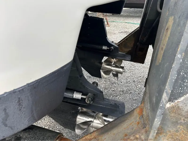 Slide: The Image of 2009 Formula 310 Bowrider I/O boat propellers on a trailer, close-up view. - 10