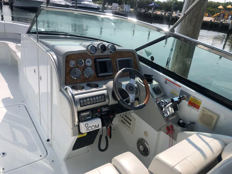Slide: The Image of 2009 Formula 310 Bowrider I/O boat dashboard with steering wheel and control panel. - 3