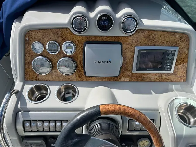 Slide: The Image of Dashboard of 2009 Formula 310 Bowrider I/O with Garmin navigation system and wood accents. - 4