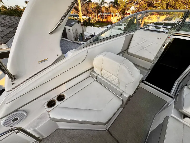 Slide: The Image of Luxurious seating area on a 2020 Regal 26XO boat with cup holders and elegant design. - 16
