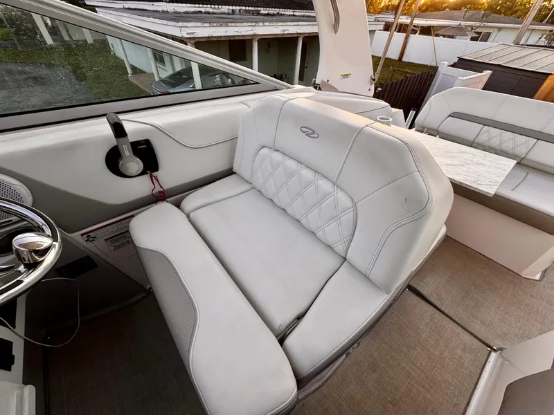 Slide: The Image of 2020 Regal 26XO boat interior with white leather seating and modern design. - 21