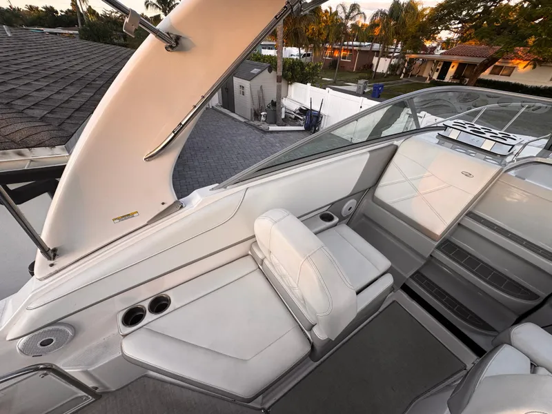 Slide: The Image of 2020 Regal 26XO boat interior with white seating and modern design. - 28