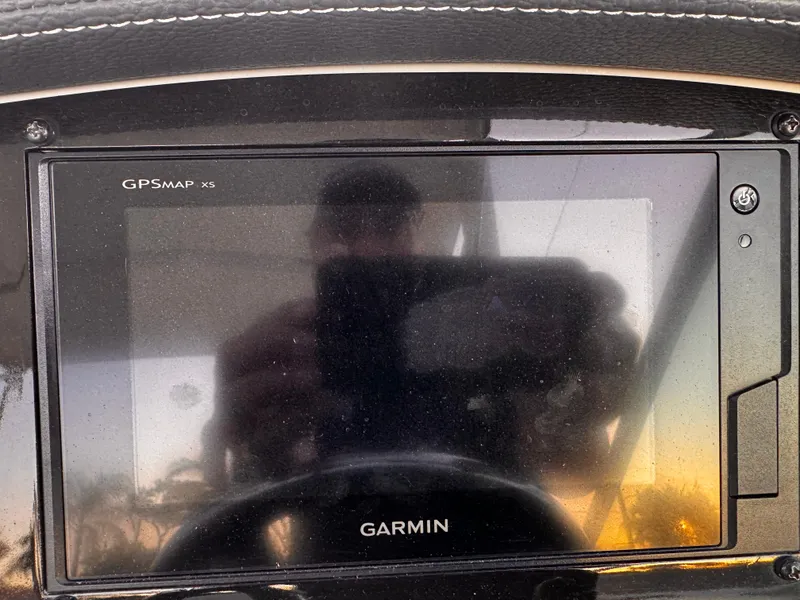 Slide: The Image of Garmin GPSMAP XS on 2020 Regal 26XO boat dashboard, reflecting sunset. - 37