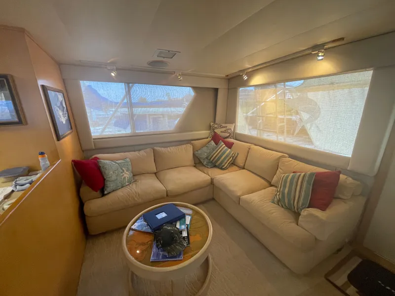 Slide: The Image of Luxurious interior of 1988 Hatteras 55 Convertible yacht with cozy seating area. - 29