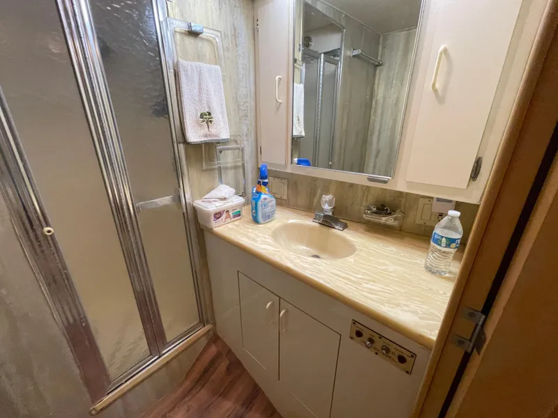 Slide: The Image of Bathroom interior of 1988 Hatteras 55 Convertible yacht with shower and sink. - 40