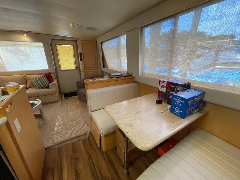 Slide: The Image of Interior of 1988 Hatteras 55 Convertible yacht with seating and dining area. - 44
