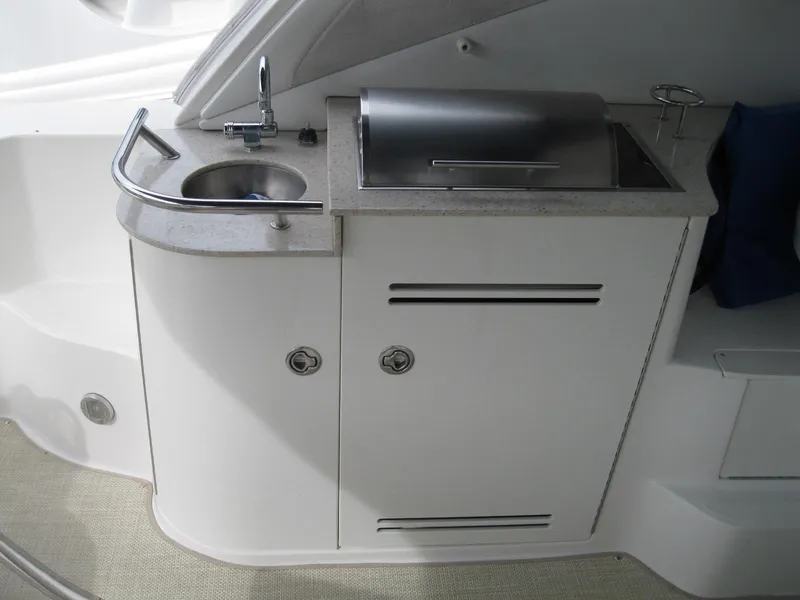Slide: The Image of 2008 Sea Ray 330 Sundancer boat kitchenette with sink and grill. - 10