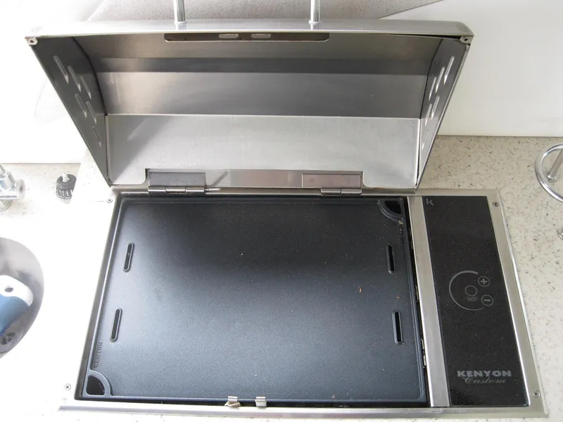 Slide: The Image of Kenyon electric grill on 2008 Sea Ray 330 Sundancer yacht, open lid, stainless steel design. - 14
