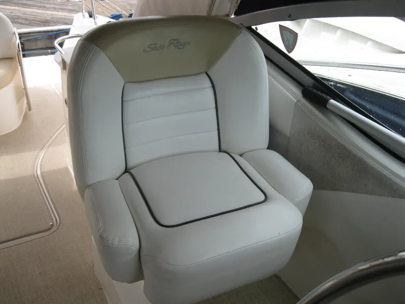 Slide: The Image of Captain's chair on 2008 Sea Ray 330 Sundancer, featuring white leather upholstery. - 18