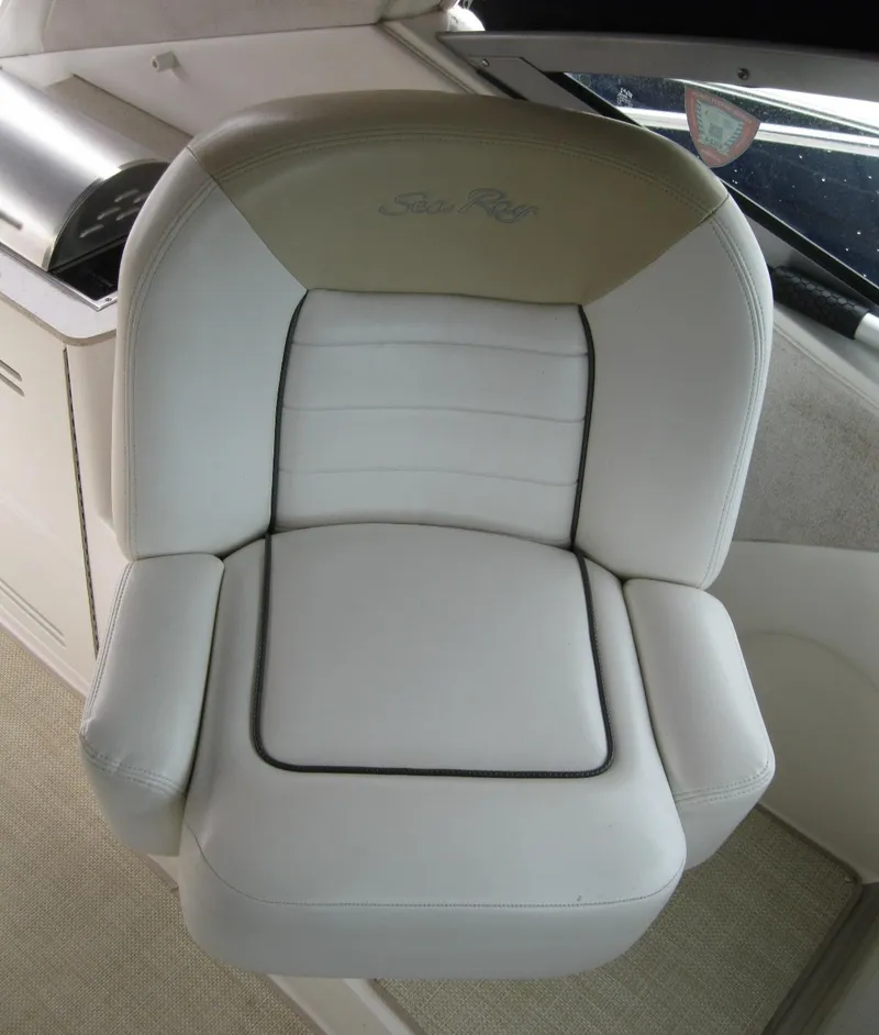 Slide: The Image of 2008 Sea Ray 330 Sundancer white captain's chair with armrests and logo. - 19