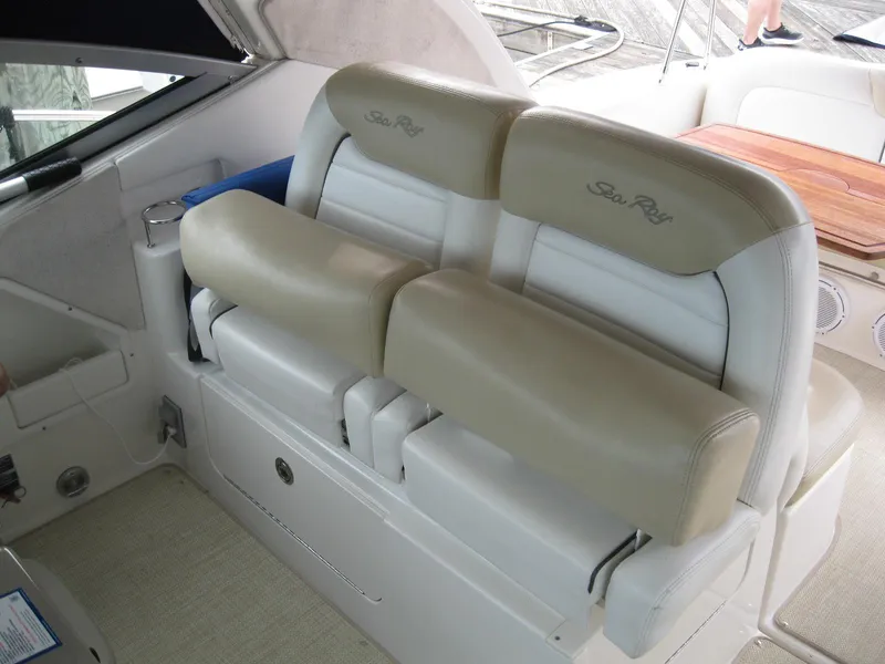 Slide: The Image of 2008 Sea Ray 330 Sundancer interior seating with beige and white upholstery. - 22