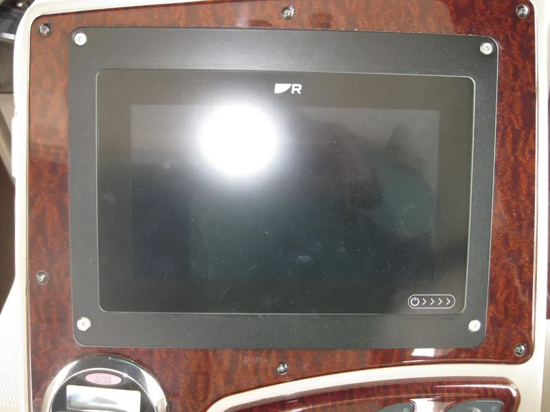 Slide: The Image of Dashboard display of 2008 Sea Ray 330 Sundancer boat with wood paneling. - 24