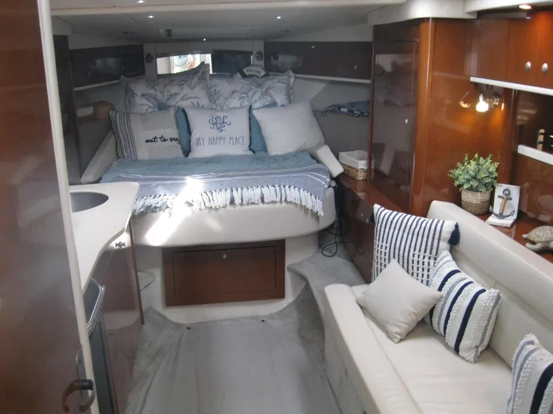 Slide: The Image of 2008 Sea Ray 330 Sundancer cabin interior with cozy seating and elegant decor. - 29