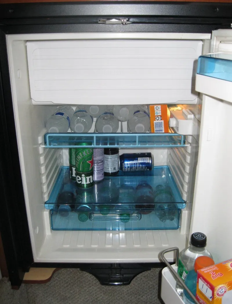 Slide: The Image of Mini fridge stocked with drinks inside a 2008 Sea Ray 330 Sundancer boat. - 37