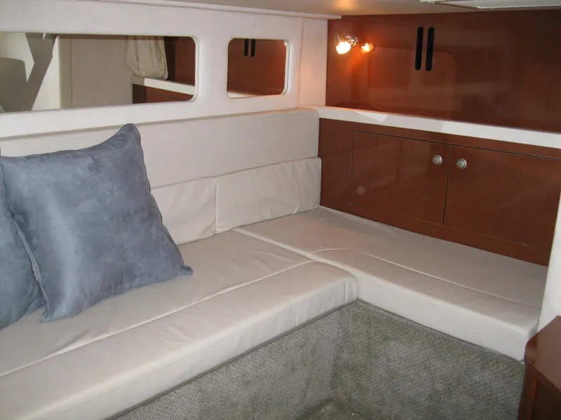 Slide: The Image of Interior of 2008 Sea Ray 330 Sundancer with cozy seating and wooden cabinetry. - 42