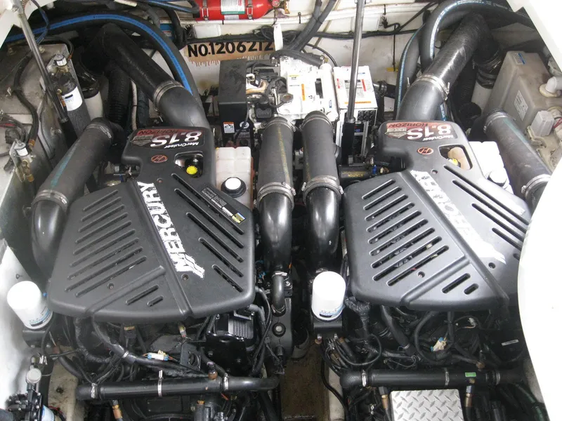 Slide: The Image of Engine room of 2008 Sea Ray 330 Sundancer with twin Mercury engines. - 49