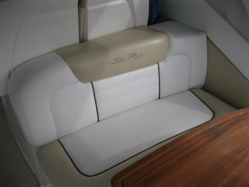 Slide: The Image of 2008 Sea Ray 330 Sundancer interior seating with beige and white upholstery. - 8