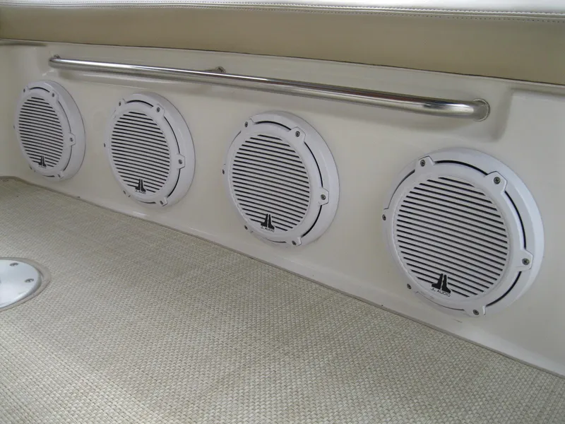 Slide: The Image of Four white speakers on a 2008 Sea Ray 330 Sundancer boat interior. - 9