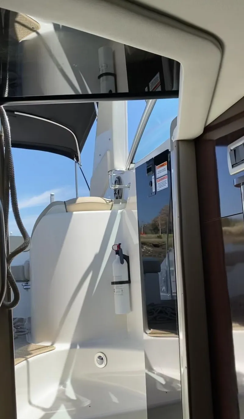 Slide: The Image of 2015 Sea Ray 280 Sundancer boat interior with modern design and safety equipment. - 19