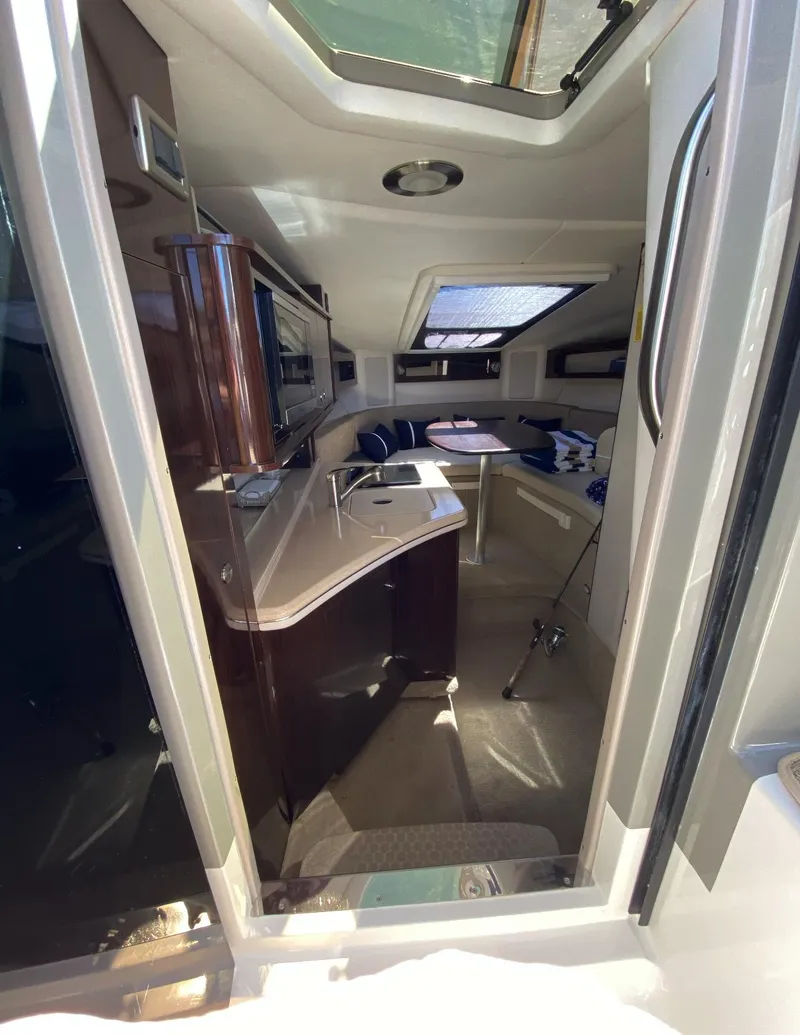 Slide: The Image of Interior view of 2015 Sea Ray 280 Sundancer boat, featuring modern amenities and sleek design. - 21