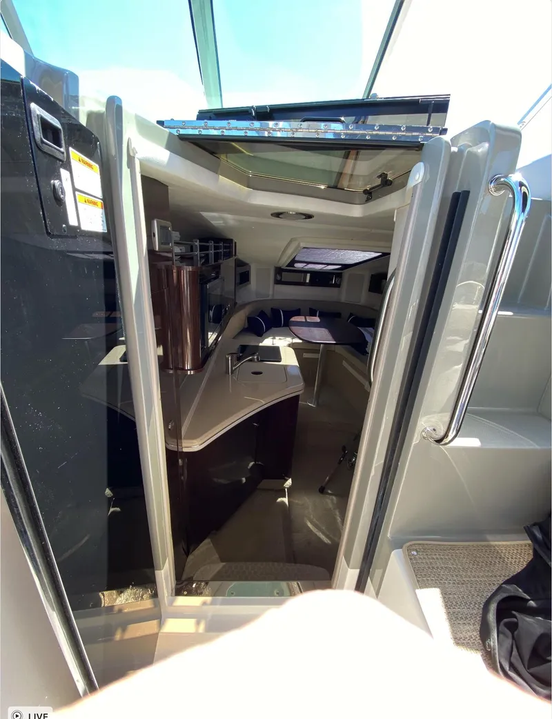Slide: The Image of Interior view of 2015 Sea Ray 280 Sundancer cabin with modern design. - 22