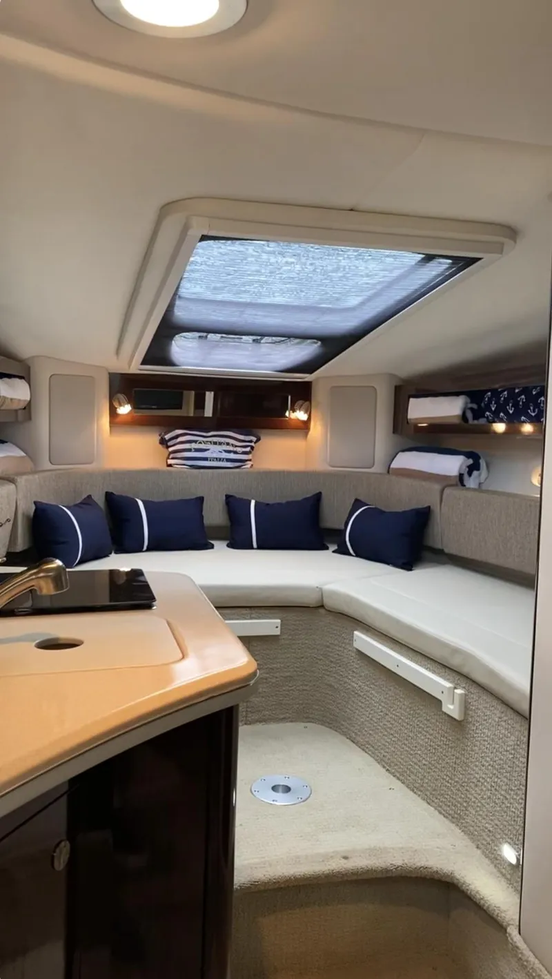 Slide: The Image of Interior of 2015 Sea Ray 280 Sundancer with cozy seating and skylight. - 27