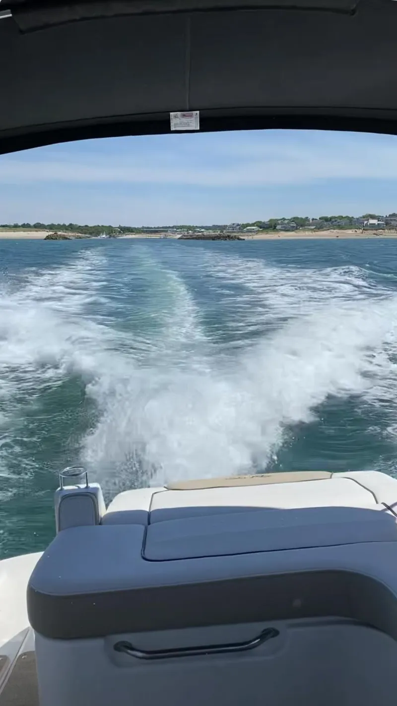Slide: The Image of 2015 Sea Ray 280 Sundancer cruising on open water, leaving a wake behind. - 29