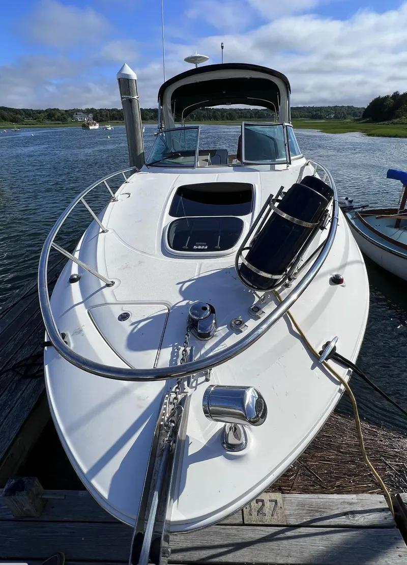 Slide: The Image of 2015 Sea Ray 280 Sundancer docked by scenic waterfront. - 9