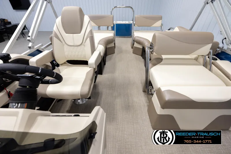 Slide: The Image of Interior of 2025 Avalon LSZ QLS pontoon boat with luxurious seating and steering wheel. - 14