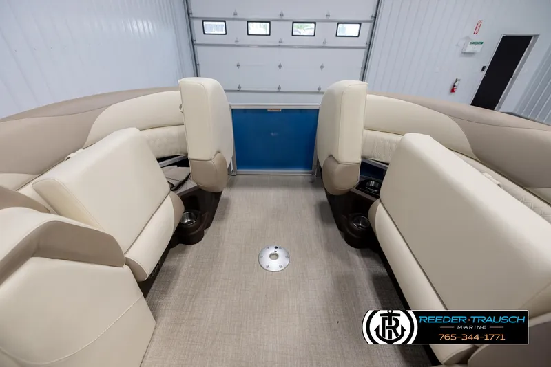 Slide: The Image of Interior of 2025 Avalon LSZ QLS pontoon boat with beige seating and cup holders. - 20