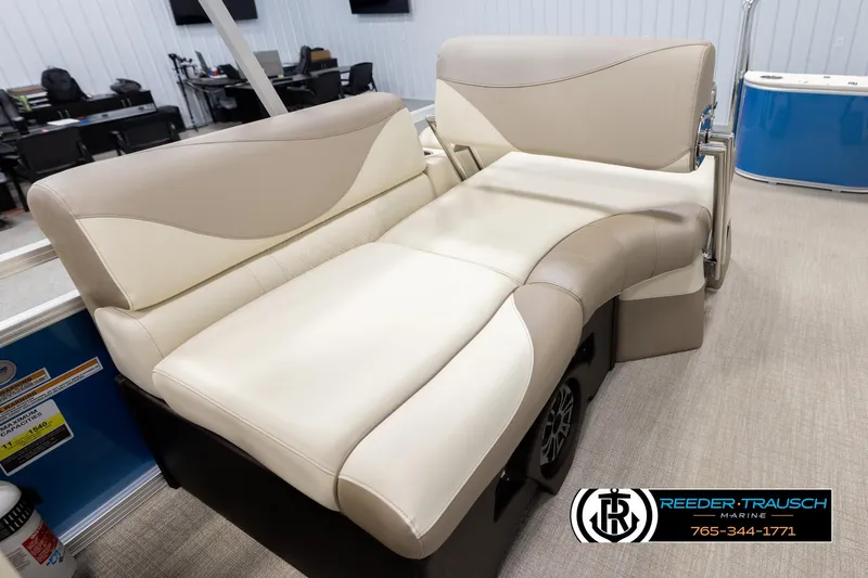 Slide: The Image of Avalon LSZ QLS 2025 boat interior with beige seating, showcased at Reeder-Trausch Marine. - 24