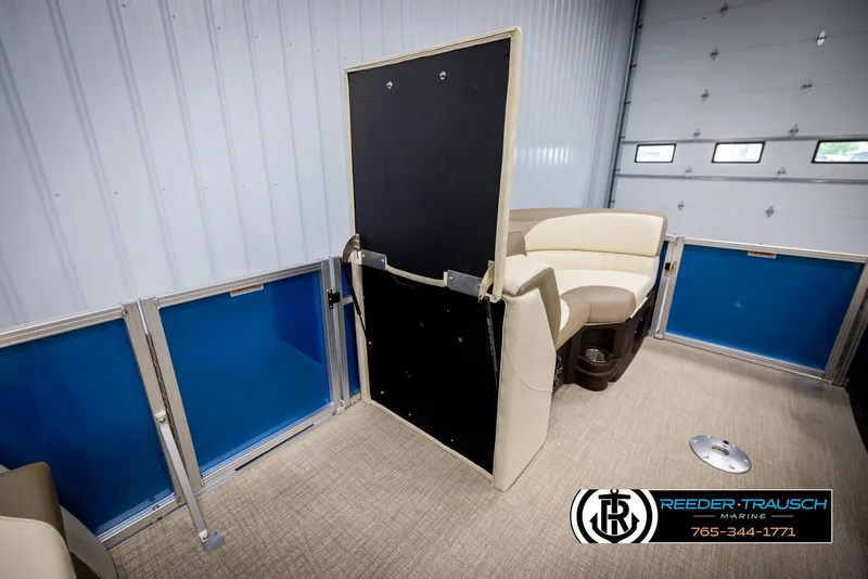 Slide: The Image of Interior of 2025 Avalon LSZ QLS pontoon boat with beige seating and blue paneling. - 26