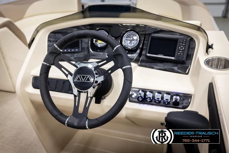 Slide: The Image of Steering wheel and dashboard of 2025 Avalon LSZ QLS boat, featuring modern controls and displays. - 31