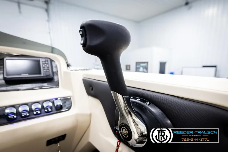 Slide: The Image of Close-up of 2025 Avalon LSZ QLS boat throttle control in a modern cockpit. - 38