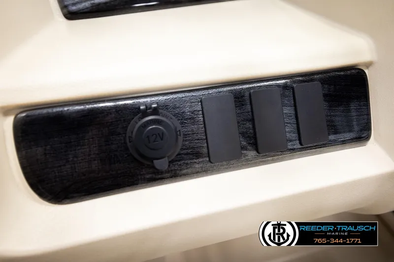 Slide: The Image of 2025 Avalon LSZ QLS dashboard with 12V marine outlet and switches. - 39