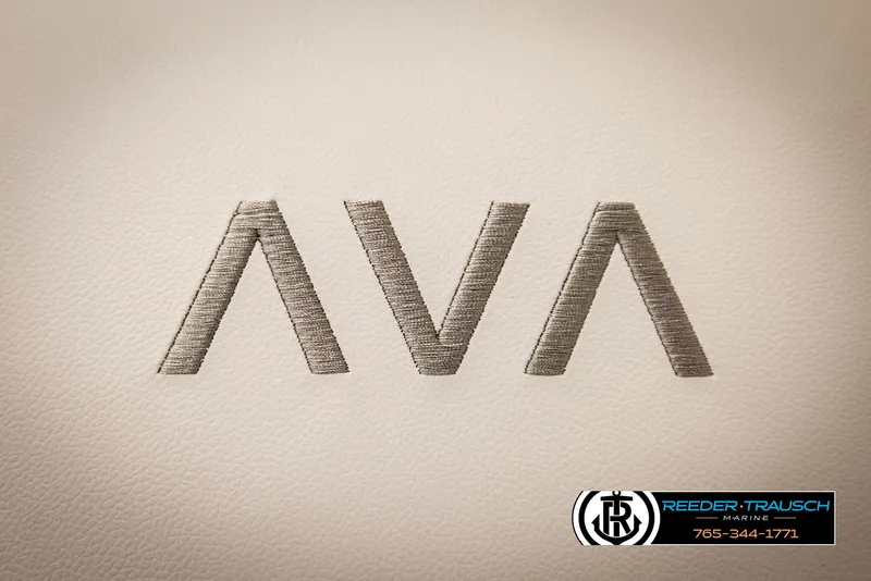 Slide: The Image of Embroidered 'AVA' logo on Avalon LSZ QLS 2025 upholstery, Reeder-Trausch Marine branding. - 41