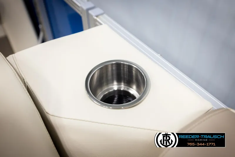 Slide: The Image of Cup holder on 2025 Avalon LSZ QLS boat with beige upholstery. - 43
