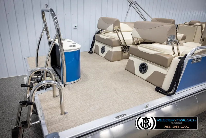 Slide: The Image of 2025 Avalon LSZ QLS pontoon boat interior with beige seating and stainless steel ladder. - 47