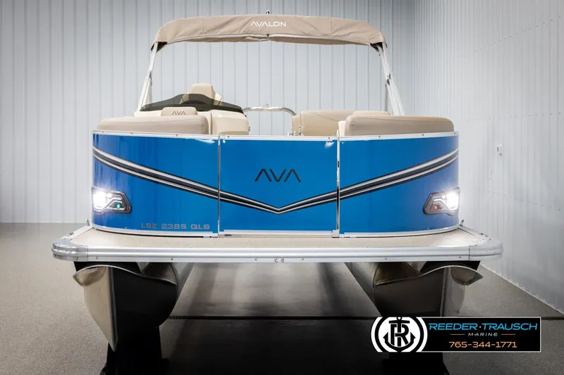 Slide: The Image of 2025 Avalon LSZ QLS pontoon boat with blue exterior in showroom. - 8