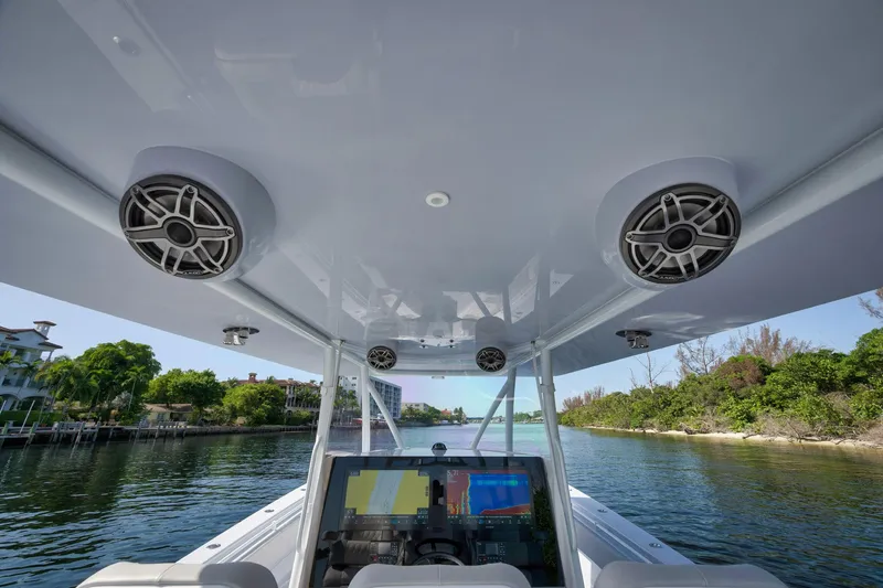 Slide: The Image of 2025 Contender 44 ST boat interior with advanced navigation system and speakers. - 20