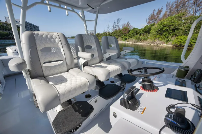 Slide: The Image of 2025 Contender 44 ST boat interior with luxurious seating and modern controls. - 22